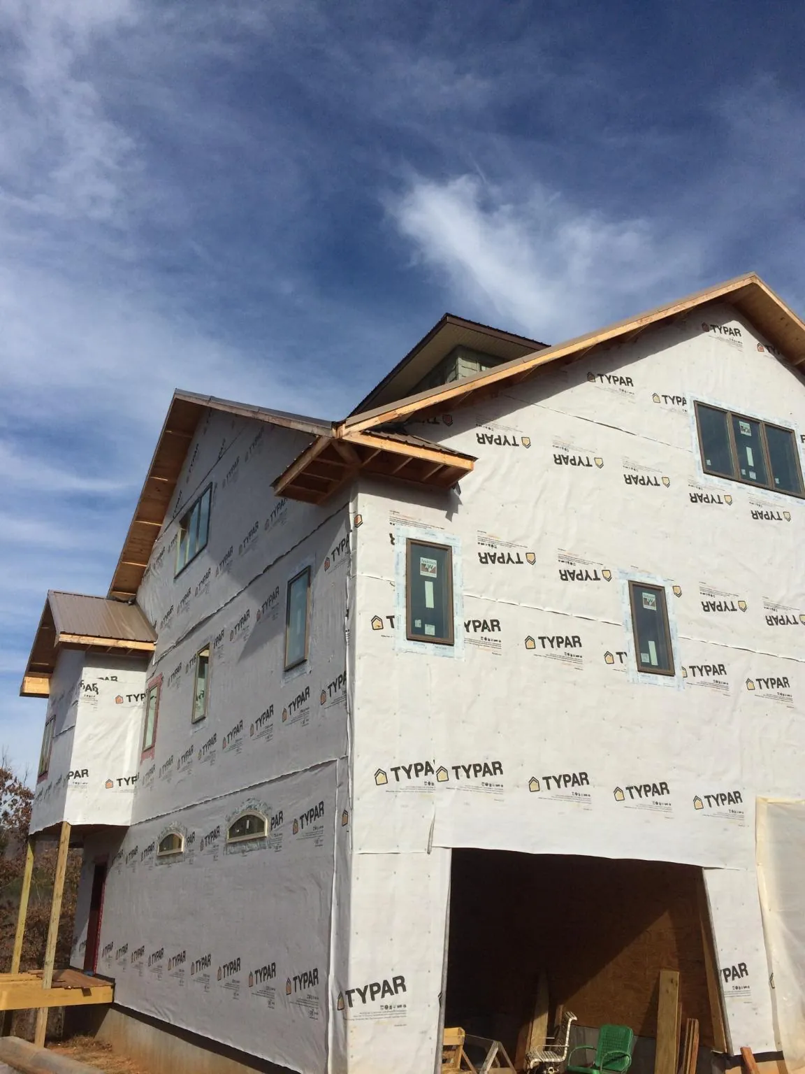 Stick built house wrapped in Typar with new roof framing and dormers in Battleboro